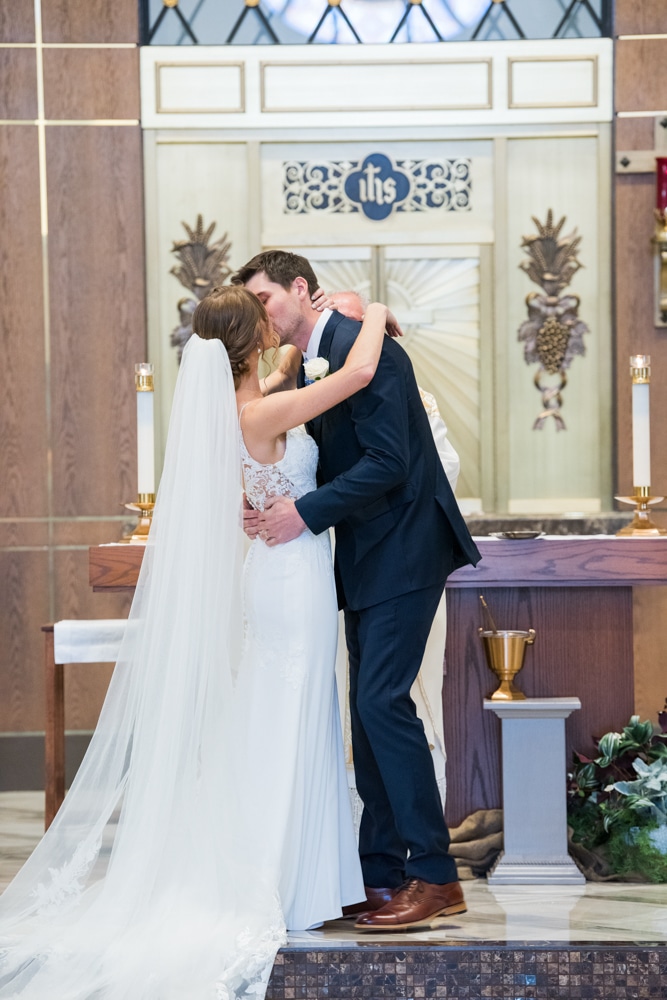 First Kiss bride and groom